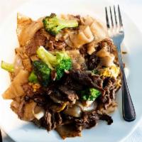 Pad See Eaw · Choice of beef, chicken, pork, or shrimp stir fried with wide rice noodles, egg, broccoli, a...