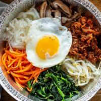 Bibimbap · Five assorted cold vegetables on a bed of rice with your choice of protein, topped with a su...