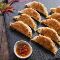 Chicken Gyoza · Pan-fried dumplings.