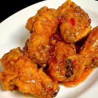 Crispy Hot Wings · Spicy. Deep-fried chicken wings coated with sweet-spicy chili sauce.