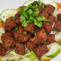 Cha Lok Lak · Stir-fried pepper marinated steak tips.

Note: Degree of doneness to the steak is medium rar...