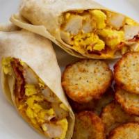 Breakfast Burrito · A tasty breakfast all wrapped up: potatoes, scrambled eggs, bacon and cheese wrapped in a fl...