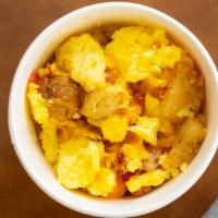 Breakfast Cup · A ready breakfast in one cup with scrambled eggs, bacon and potatoes.