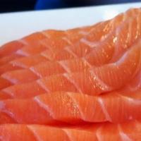 Salmon Sashimi · Three pieces.