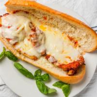 Chicken Parmigiana · Breaded chicken cutlet topped with tomato sauce then baked with mozzarella cheese.