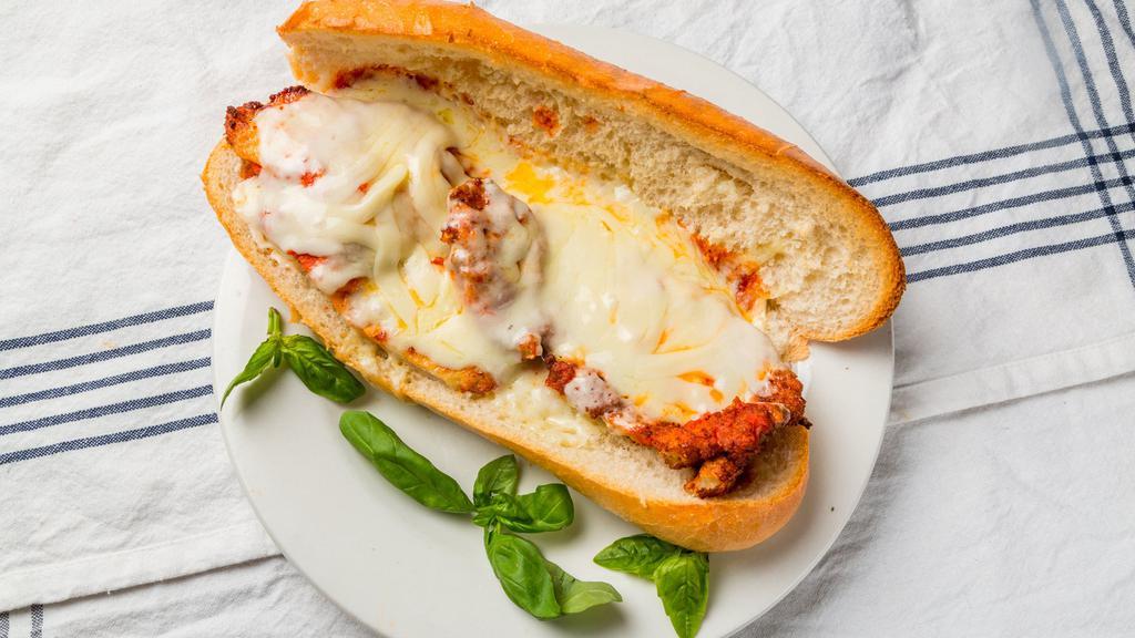 Chicken Parmigiana · Breaded chicken cutlet topped with tomato sauce then baked with mozzarella cheese.