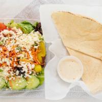 Greek Salad · Iceberg lettuce, spring mix lettuce, tomatoes, cucumbers, carrots, red and green peppers, pe...