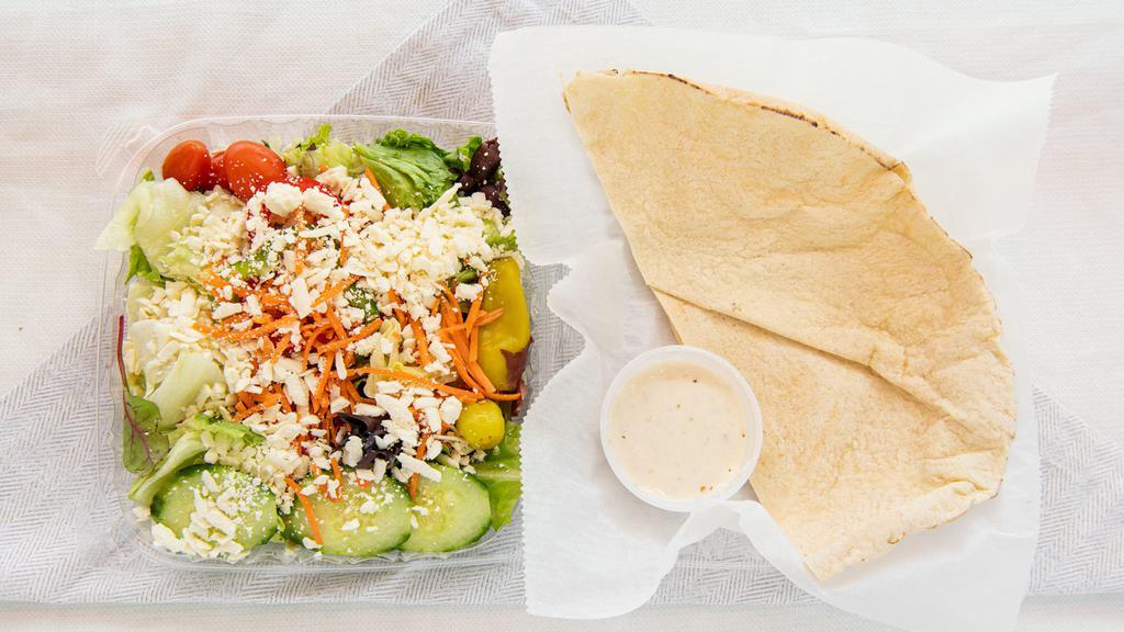 Greek Salad · Iceberg lettuce, spring mix lettuce, tomatoes, cucumbers, carrots, red and green peppers, pepperoncinis, feta cheese and Kalamata olives. Served with pita bread.