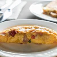 Southwest Omelette · Deliciously made eggs with grilled chicken, green peppers, onions, tomatoes, and cheddar che...