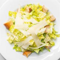 Truffle Caesar · Romain lettuce, garlic croutons, anchovies, truffle lemon Parmesan vinaigrette.