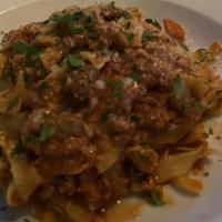 Bolognese Da Abruzzo · Handmade rigatoni pasta prepared with a typical abbruzzese style veal and beef ragout, enric...