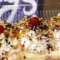 Banana Boat · Traditional banana boat is made with chocolate, strawberry and vanilla ice cream. Topped wit...