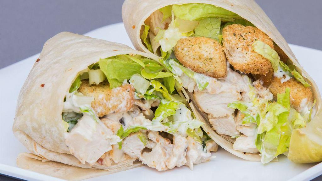 Chicken Caesar Wrap · Our house Caesar rolled-up nice and neatly your choice of blackened or grilled chicken.