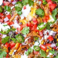 Serious Nachos · Your choice of traditional chili, buffalo chicken, or meatless.   Served with sour cream and...