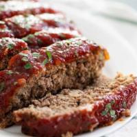 Not Your Momma'S Meatloaf · Thick sliced flame-grilled meatloaf with a brown sugar tomato glaze served with mashed potat...