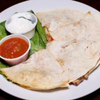 Tavern Quesadilla · Cheddar cheese filled tortillas melted and grilled to perfection.