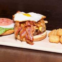The Breakfast Burger · Try our traditional burger w/ a breakfast twist!  Topped with bacon, fried egg and cheddar c...