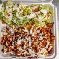 Chicken Over Rice · Served with rice, lettuce, tomato, and your choice of white sauce, hot sauce or BBQ sauce