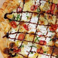 Fresco · Fresh sliced tomatoes and creamy ricotta over our EVOO & Garlic blend topped with shredded m...