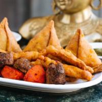 New Delhi'S Special Hors D' Oeuvres · Assorted appetizers: chicken pakora, veg samosa, chicken tikka and seekh kebab.  Served with...