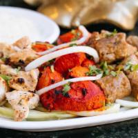 Special Mixed Grill · Special assortment of chicken tandoori, chicken tikka and seekh kebab.  Served with basmati ...