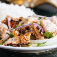 Chicken Reshmi Kebab · Boneless chicken flavored with onions and ginger, then barbecued.  Served with basmati rice.