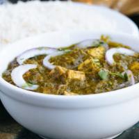 Saag Paneer (Palak Paneer) · Gluten-free. Minced spinach with fried cheese cubes with spices.  Served with basmati rice.