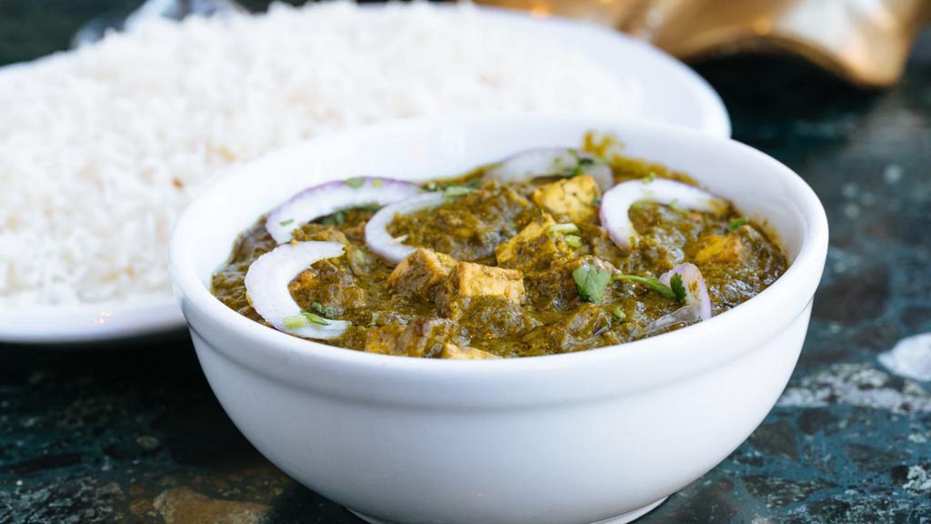 Saag Paneer (Palak Paneer) · Gluten-free. Minced spinach with fried cheese cubes with spices.  Served with basmati rice.