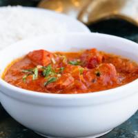 Paneer Masala · Gluten-free. Cheese cubes cooked with tomatoes, onions, peppers and butter sauce.  Served wi...