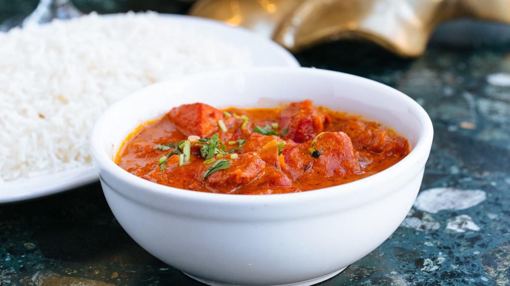 Paneer Masala · Gluten-free. Cheese cubes cooked with tomatoes, onions, peppers and butter sauce.  Served with basmati rice.
