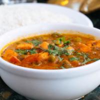 Mutter Paneer · Gluten-free. Fried cheese cubes cooked with peas in a mild sauce.  Served with basmati rice.