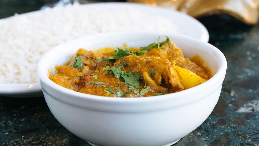 Chicken Vindaloo · Selected pieces of chicken cooked in sharply spiced tomato sauce.  Served with basmati rice.