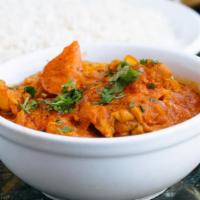 Chicken Jal Farezi · Boneless chicken cooked with onions, green peppers and tomatoes.  Served with basmati rice.