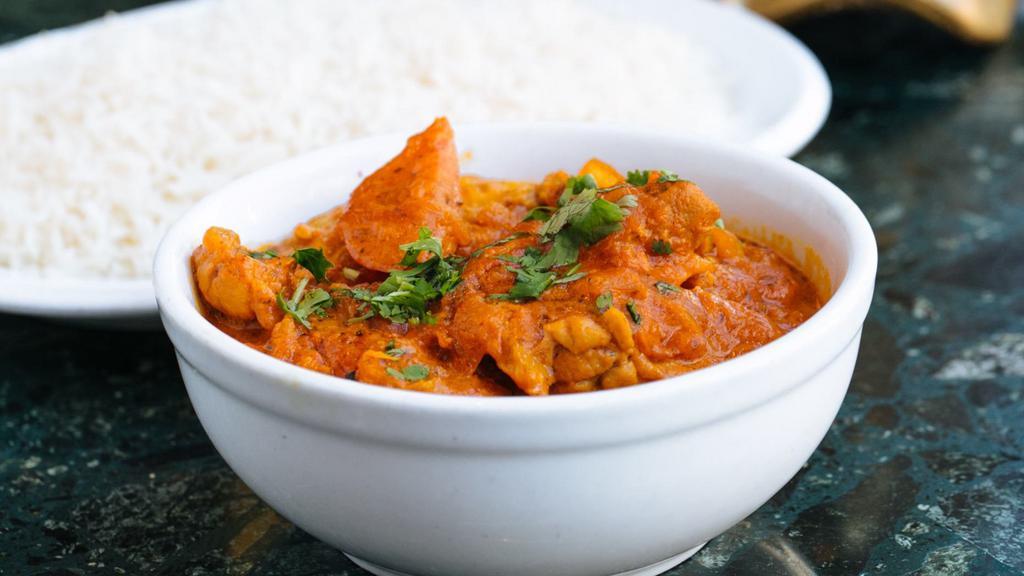 Chicken Jal Farezi · Boneless chicken cooked with onions, green peppers and tomatoes.  Served with basmati rice.