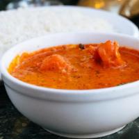 Shrimp Nargisi · Shrimp cooked with coconut in a spicy sauce.  Served with basmati rice.