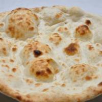 Naan · Unleavened white bread baked in the clay oven.