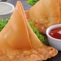 Vegetable Samosa · Crisp fried turnover, filled with delicious, mildly spiced potatoes & green peas.