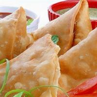 Chicken Samosa · Crisp fried turnover, filled with delicious, mildly spiced chicken.