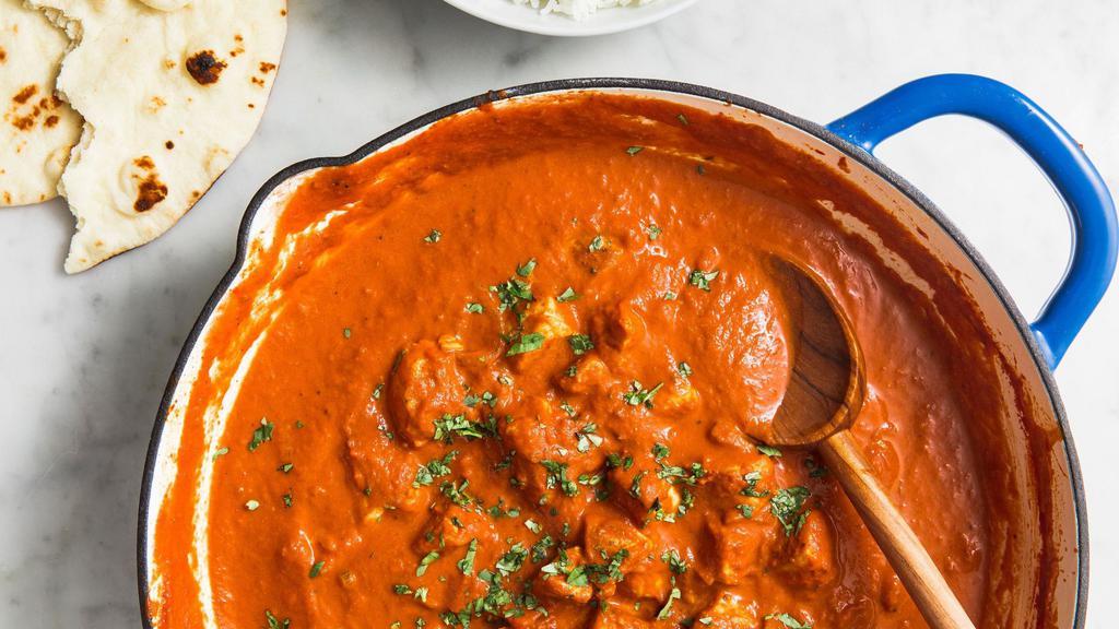 Chicken Tikka Masala · Chicken cubes cooked in tomato, onion sauce, and spices.