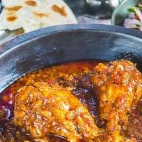 Chicken Vindaloo · Chicken and potatoes cooked in onion and tomato sauce.