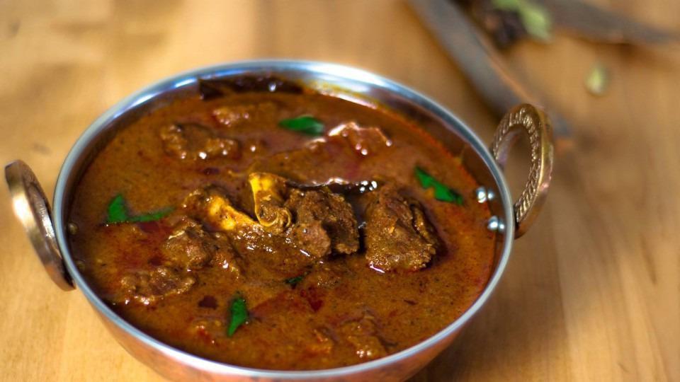 Goat Masala Curry · Goat cooked in onion, tomatoes, and exotic spices.