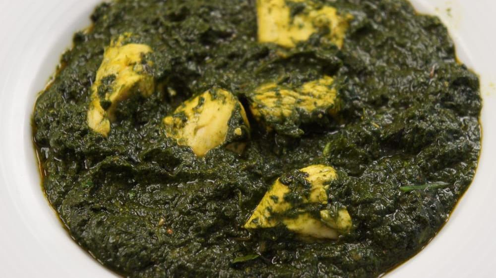 Saag Chicken · Chicken cooked with finely cut garden fresh spinach and herbs.