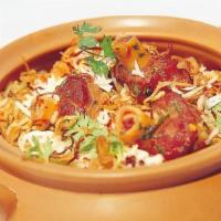 Goat Biryani · Long grain basmati rice delicately cooked with goat, yogurt, & special spices.