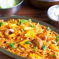 Paneer Biryani · Long grain basmati rice mixed with paneer, seasoned with Indian herbs and spices.