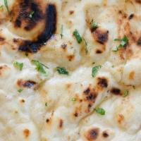 Butter Naan · Clay oven baked bread prepared fresh with melted butter.
