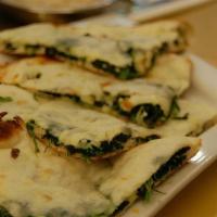 Green Naan · Clay oven baked bread prepared fresh stuffed with spinach and paneer.