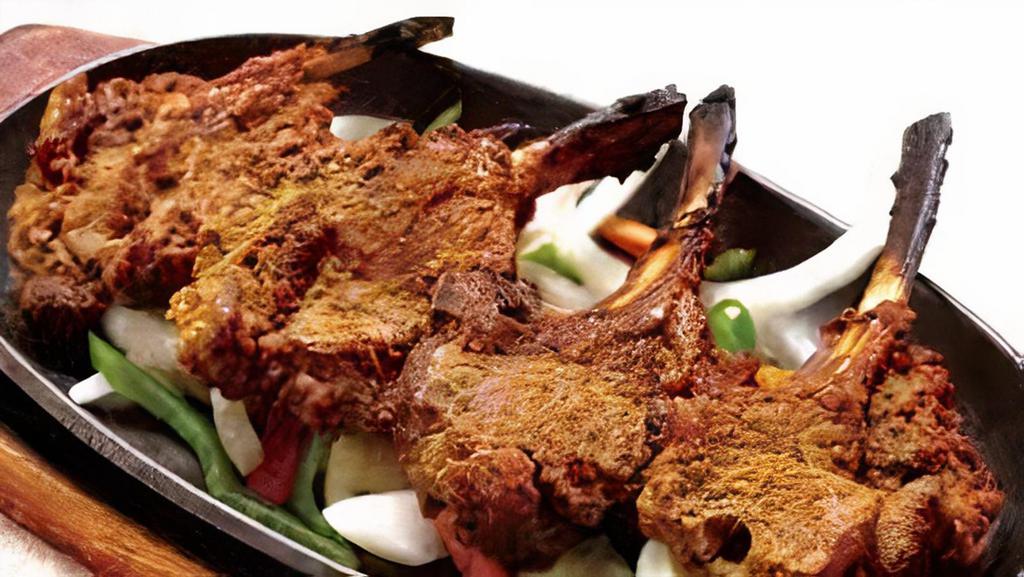 Lamb Chops · French Cut lamb chops marinated in homemade spices served hot with different spice levels.