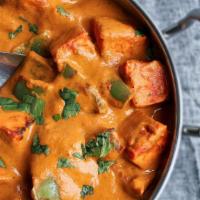 Paneer Tikka Masala · Fried paneer cubes cooked in tomato, onion sauce, and spices.