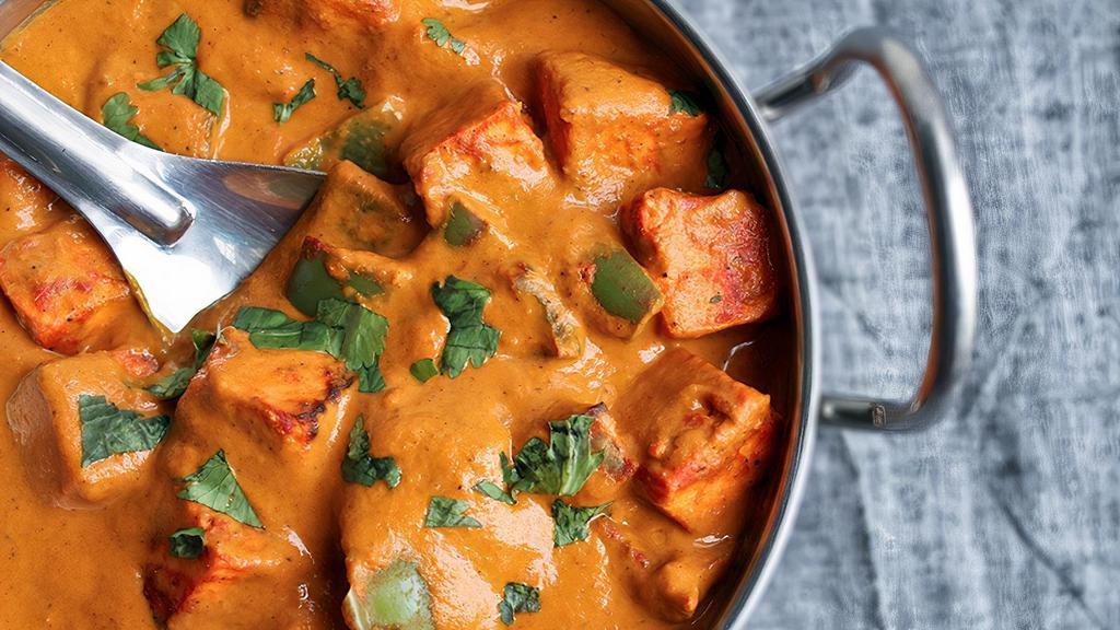 Paneer Tikka Masala · Fried paneer cubes cooked in tomato, onion sauce, and spices.