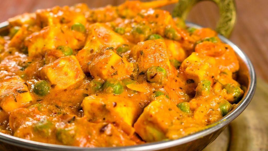 Matar Paneer · Green peas and home made cheese cooked with spices.